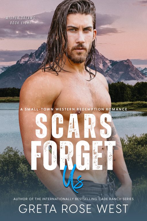 Handsome shirtless man with piercing blue eyes and shoulder-length brown hair. The Grand Teton Mountains and Snake River are in the background.